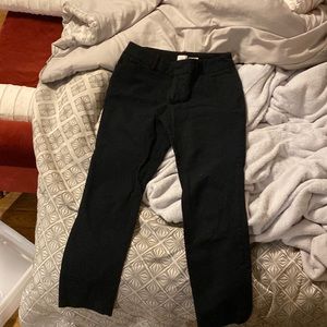 Black ankle-length trousers